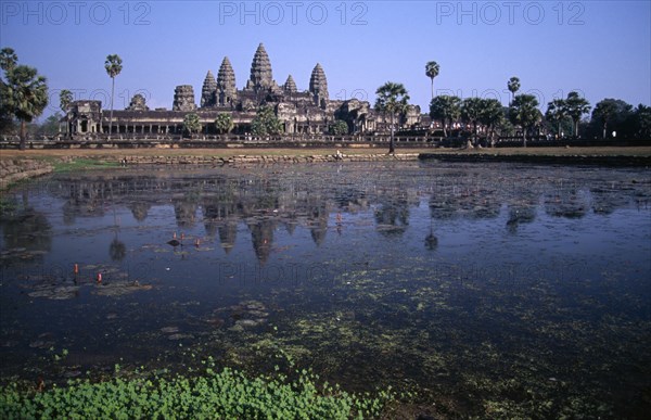 CAMBODIA, Siem Reap, Angkor Wat, The central complex seen across the water lilly pond