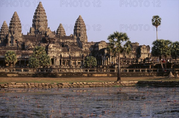 CAMBODIA, Siem Reap, Angkor Wat, The central complex seen across the water lilly pond