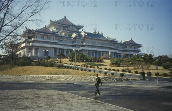 NORTH KOREA, Pyongyang, Grand peoples Study House exterior with people.