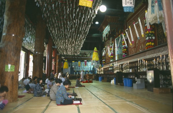 SOUTH KOREA, Seoul, Chogyesa Temple named after the Chogye Buddhist sect Interior with worshippers.