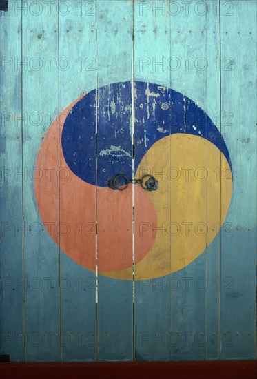 SOUTH KOREA, Religion, Buddhist, Door of Buddhist temple painted with Taegukki symbol representing Korea as equal amongst nations.