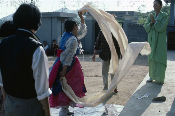 SOUTH KOREA, Religion, Shamanism, Female mudang whose role is to act as an intermediary between the living and spirit worlds in trance.