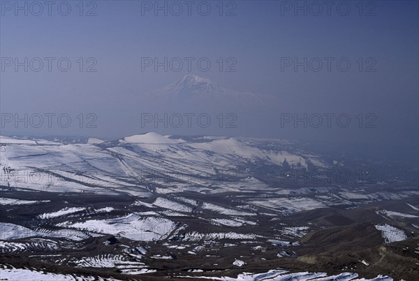 ARMENIA, Mount Ararat, Aerial view over Mount Ararat in Turkey from Vokhchaberd with polluted air from Yerevan on the right.