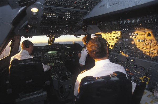 SOUTH AFRICA, Central, South African Airways Boeing 747 300 cockpit with pilot and crew at daybreak over central Africa on a flight from London to Cape Town