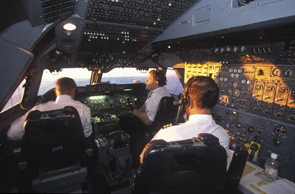 SOUTH AFRICA, Central, South African Airways Boeing 747 300 cockpit with pilot and crew at daybreak over central Africa on a flight from London to Cape Town