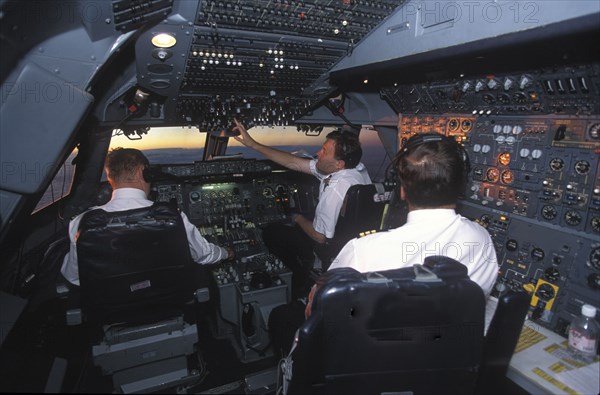 SOUTH AFRICA, Central, South African Airways Boeing 747 300 cockpit with pilot and crew at daybreak over central Africa on a flight from London to Cape Town