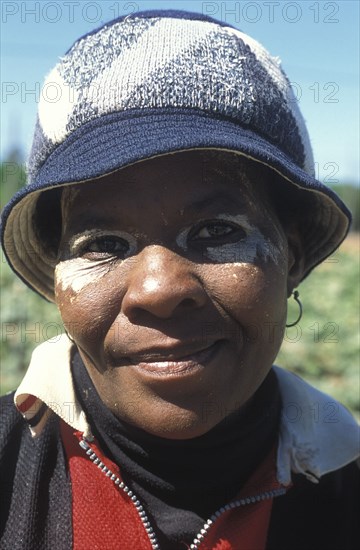 SOUTH AFRICA, Western Cape, Stellenbosch, Portrait of a female agricultural farm worker at Mooiberg fruit and vegetable farm
