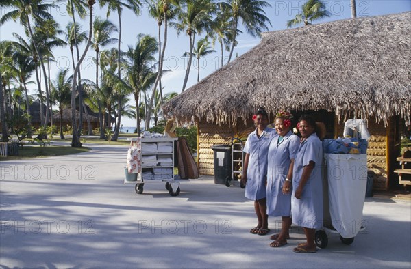 PACIFIC ISLANDS, French Polynesia, Tuamotu Islands, Ringiroa.  Women workers in hotel complex.