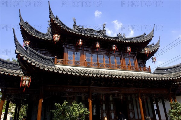 CHINA, Shanghai, Yuyuan Gardens. angled view looking up at the elaborate roof of a traditional style building