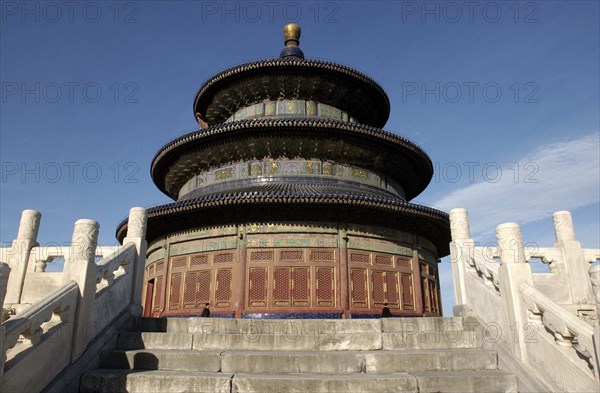 CHINA, Beijing, Tiantan Park, aka The Temple of Heaven. Angled view looking up steps toward the Hall of Prayer for Good Harvests