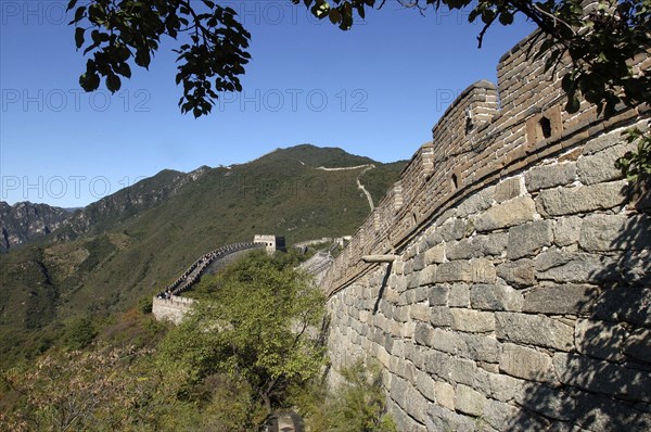 CHINA, Great Wall, View alongside a section of the wall which runs through the hilly green landscape