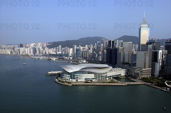HONG KONG, Kowloon, Aerial view over the New Convention Centre on the waterfront and cityscape behind