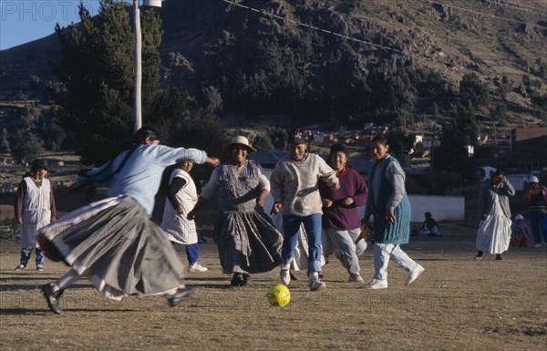 BOLIVIA, La Paz, Copacabana, Local women playing football.