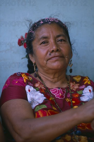 MEXICO, Oaxaca, Juchitan, Head and shoulders portrait of woman.  Family matriarch.