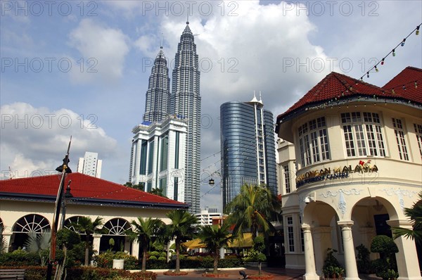 MALAYSIA, Kuala Lumpur, View from city street toward the Petronas Towers and other tall architecture