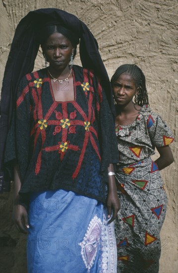 NIGER, Tribal People, Threequarter portrait of two young Tuareg women.