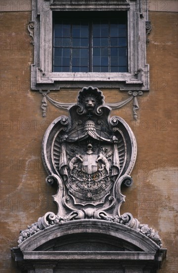 ITALY, Lazio, Rome, Piazza del Campidoglio.  Exterior detail of the Palazzo Senatorio or Senators Palace with carved stone heraldic coat of arms.