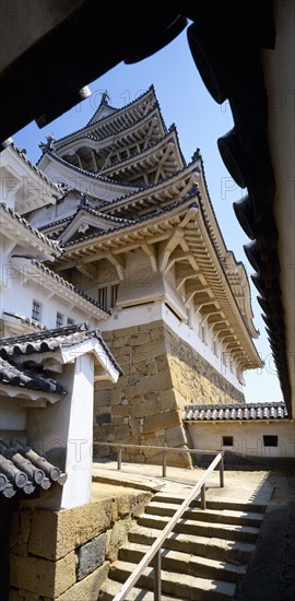 JAPAN, Honshu, Himeji, Himeji Castle also known as Shirasagi jo meaning the White Egret Castle. Angled view of the five storey Main Tower