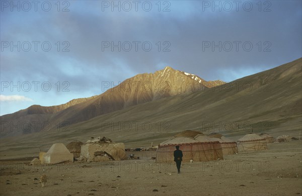AFGHANISTAN, Traditional Homes, Kirghiz yurts in bleak mountain landscape.