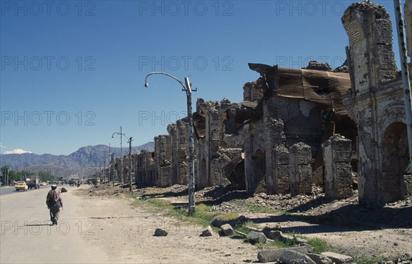 AFGHANISTAN, Kabul, Badly damaged housing lining street.