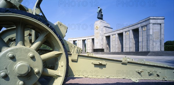 GERMANY, Berlin, Tiergarten. View over canon base toward the the Russian War Memorial with statue of a soldier atop