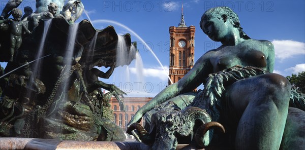 GERMANY, Berlin, Alexanderplatz. View of the Rathaus seen from the Neptune Fountain in the immediate foreground