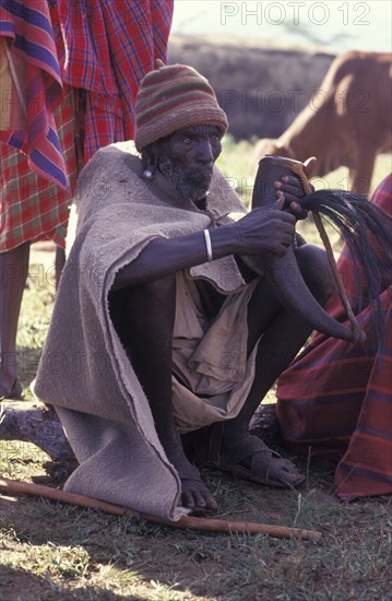 KENYA, Kajiado, Gourds filled with honey beer are drunk at the beginning of the an initiation ceremony that will bring the young Maasai Moran or young warriors into manhood.