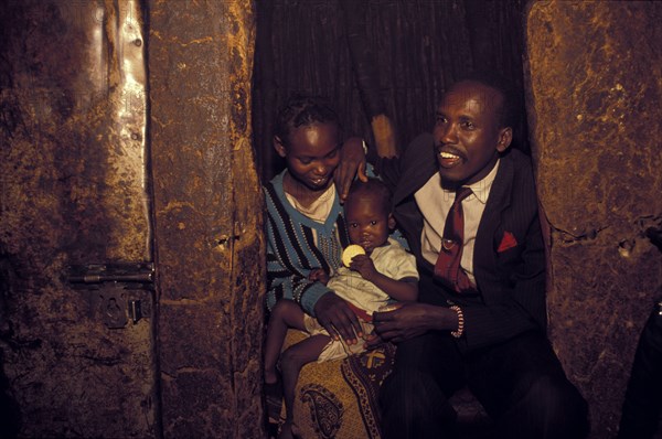 KENYA, Kajiado, Moses Mpoke is a Maasai man who works in Nairobi during the week returning to his traditional Maasai village home at the weekend.