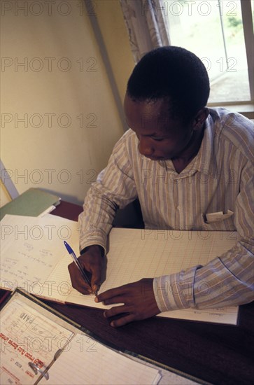 KENYA, , An accountant doing accounts.