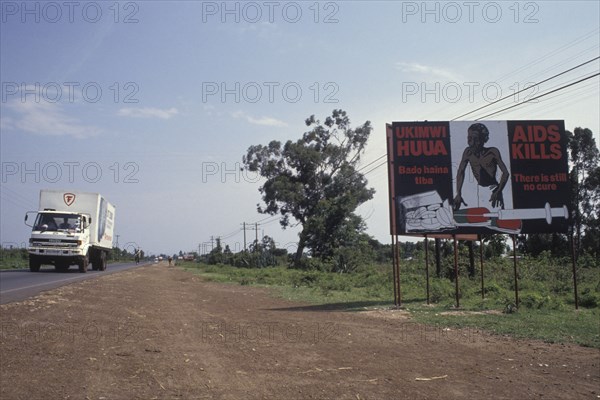 KENYA, , AIDs poster at the side of the main truck route that connects Kenya with Uganda. Aids was spread by truck drivers.