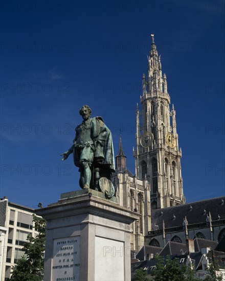BELGIUM, Flemish Region, Antwerp, Cathedral of Notre Dame with statue of the seventeenth century artist Peter Paul Rubens in the foreground
