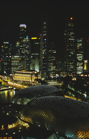 SINGAPORE, , Night view of Esplanade with illuminated Theatres on the Bay in the foreground and financial district beyond