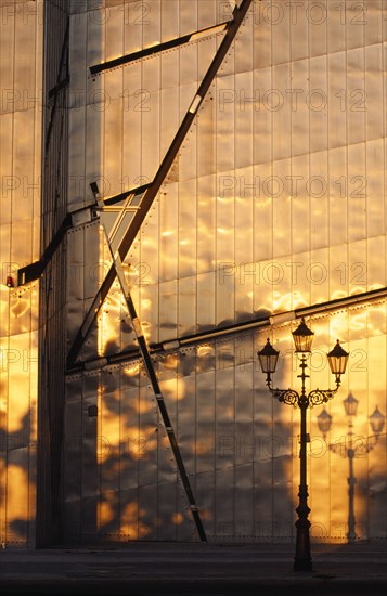 GERMANY, Berlin, Detail of the Judisches Museum metalic exterior reflecting the orange light of the evening sun