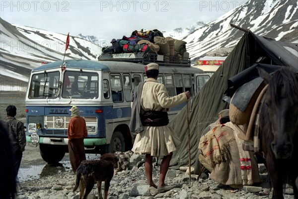 INDIA, Ladakh, Bus at a camp stop on the road from Leh to Manali which is the second highest motorable road in the World reaching an elevation of 5328m at Taglang La