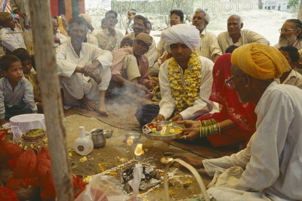 INDIA, Rajasthan, Udaipur, Puja meaning respect offering or prayers forming part of a memorial service for a recently deceased man.