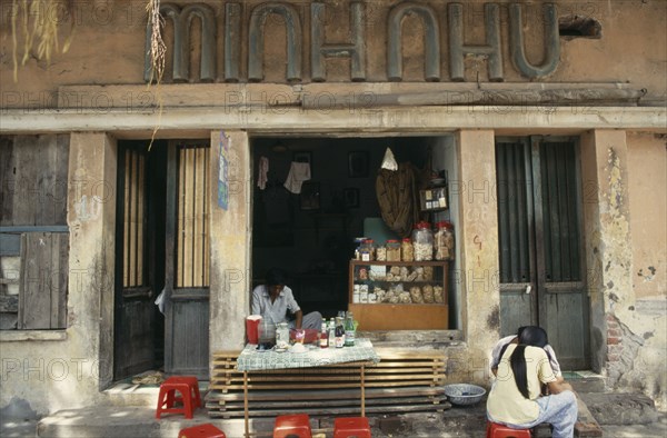 VIETNAM, North, Hanoi, Street cafe with customers.