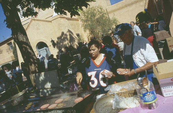 USA, New Mexico, Albuquerque, Making burgers in San Felipe de Neri church grounds in the old town plaza