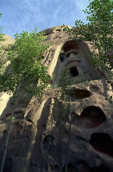 CHINA, Gansu, Zhangye, Angled view looking up at section of the Mati sa Temple built in to the cliff face