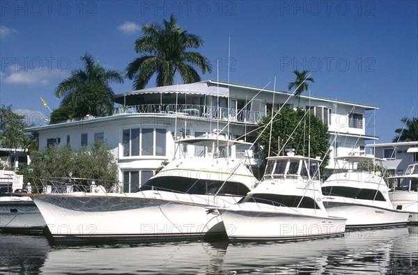 USA, Florida, Fort Lauderdale, Yachts moored outside waterfront houses on Fort Lauderdales waterways