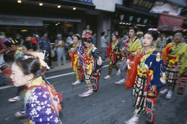 JAPAN, Chiba, Narita, Festival procession with young girls wearing traditional kimonos during the July Gion Matsuri