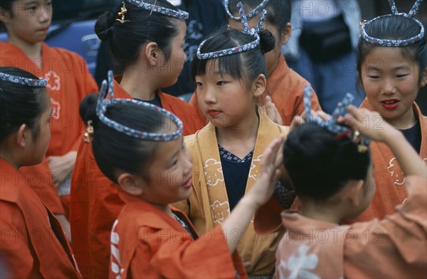 JAPAN, Chiba, Tako, 10-12 year old girls called tekomae in traditional costume during July Gion Matsuri from Uemachi neighborhood