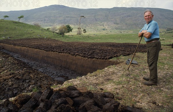 IRELAND, County Mayo, Farming, Peat cutter.