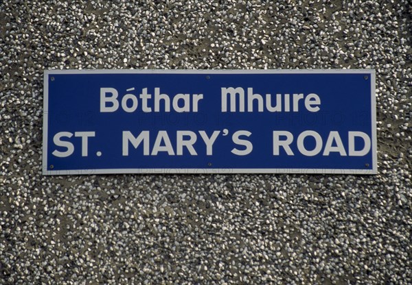 IRELAND, Donegal, Inishowen, Street name sign in Gaelic and English.