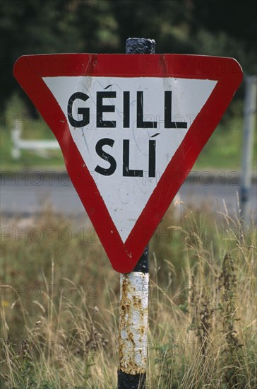 IRELAND, Donegal, Inishowen, Road sign in Gaelic.