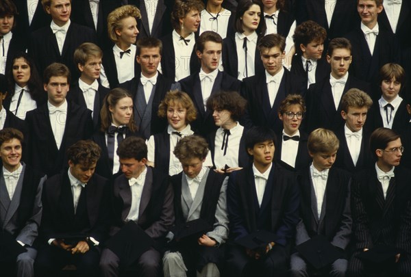 ENGLAND, Oxfordshire, Oxford University, First year students at University College pose for a college photograph in front of the main building