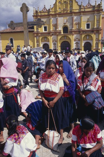 MEXICO, Chiapas, San Cristobal de las Casas, Zapatista demonstration with indigenous indian people gathered outside yellow building