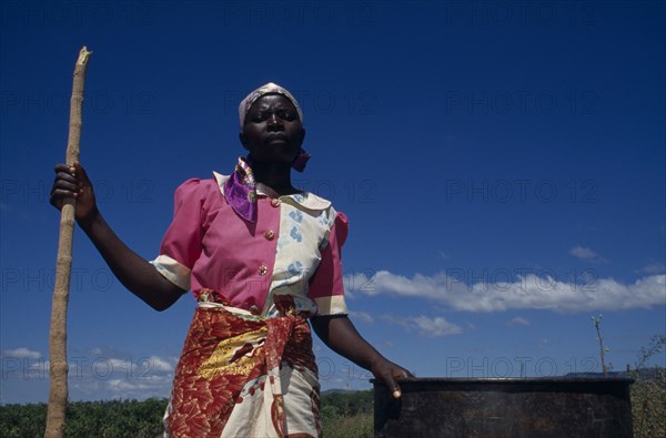 MALAWI, Lipangwe, Farm worker on organic training farm LOMADEF making chicken manure