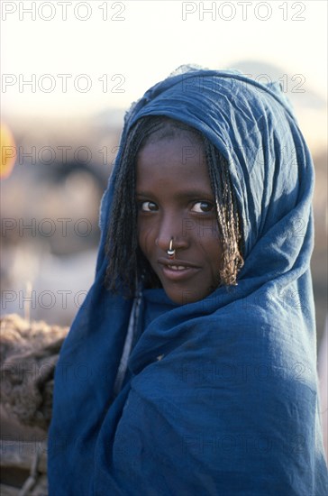 ETHIOPIA, People, Body Decoration, Girl in blue shawl with light facial scarification wearing a hooped nose ring