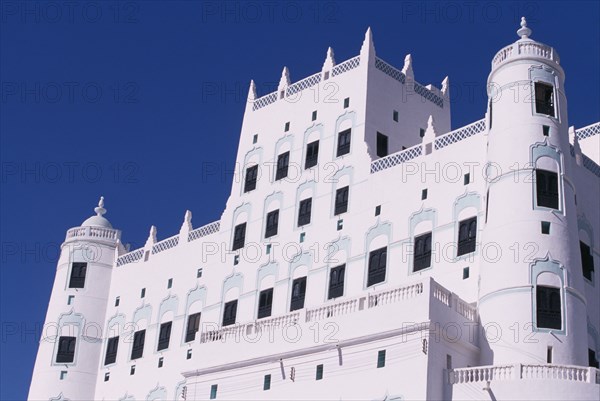 YEMEN, Say’un, Sultans Palace with view of the top half of white plaster facade.