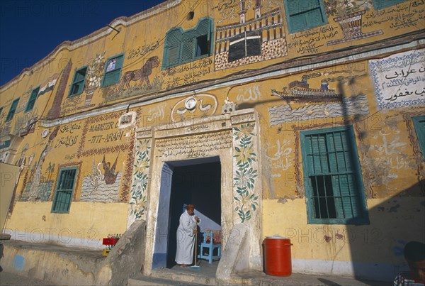 EGYPT, Dra Abul Naga, Detail of painted mural on exterior wall of alabaster shop.